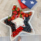A White star plate with a fruit dessert and our patriotic towel folded on the side.