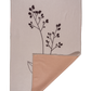 Cream colored background with a black minimal flower design.  It is also showing the blush color of the double sided microfiber dish towel design.